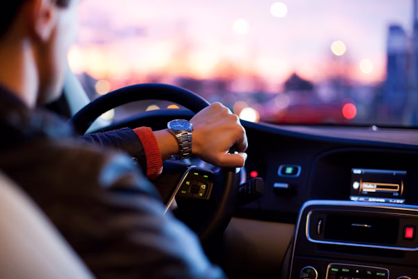 Driver reviewing auto insurance options on a modern comparison platform showing competitive quotes and coverage details